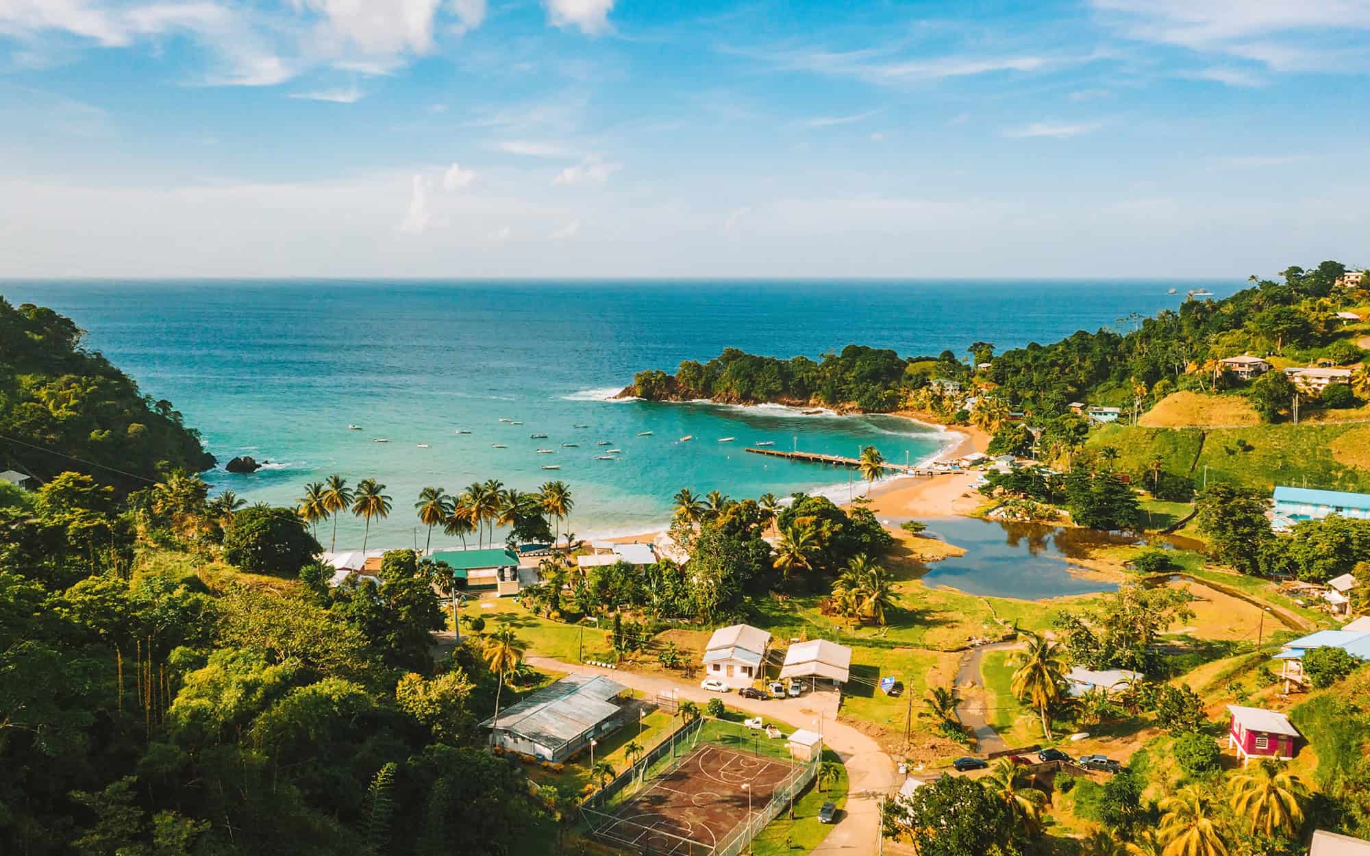 Beautiful tropical Barbados island. View of the golden beach with palms and crystal clear water. Perfect holidays background