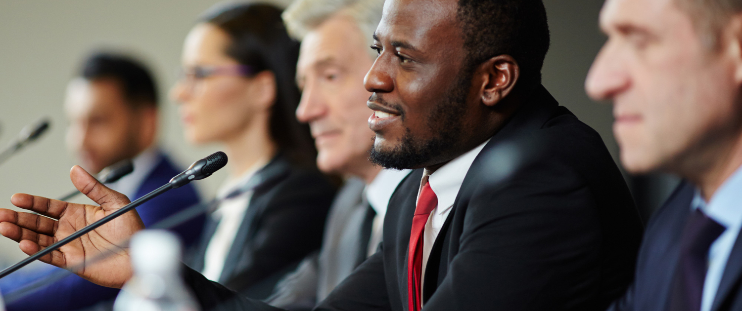 Side view of a politician public speaking at conference