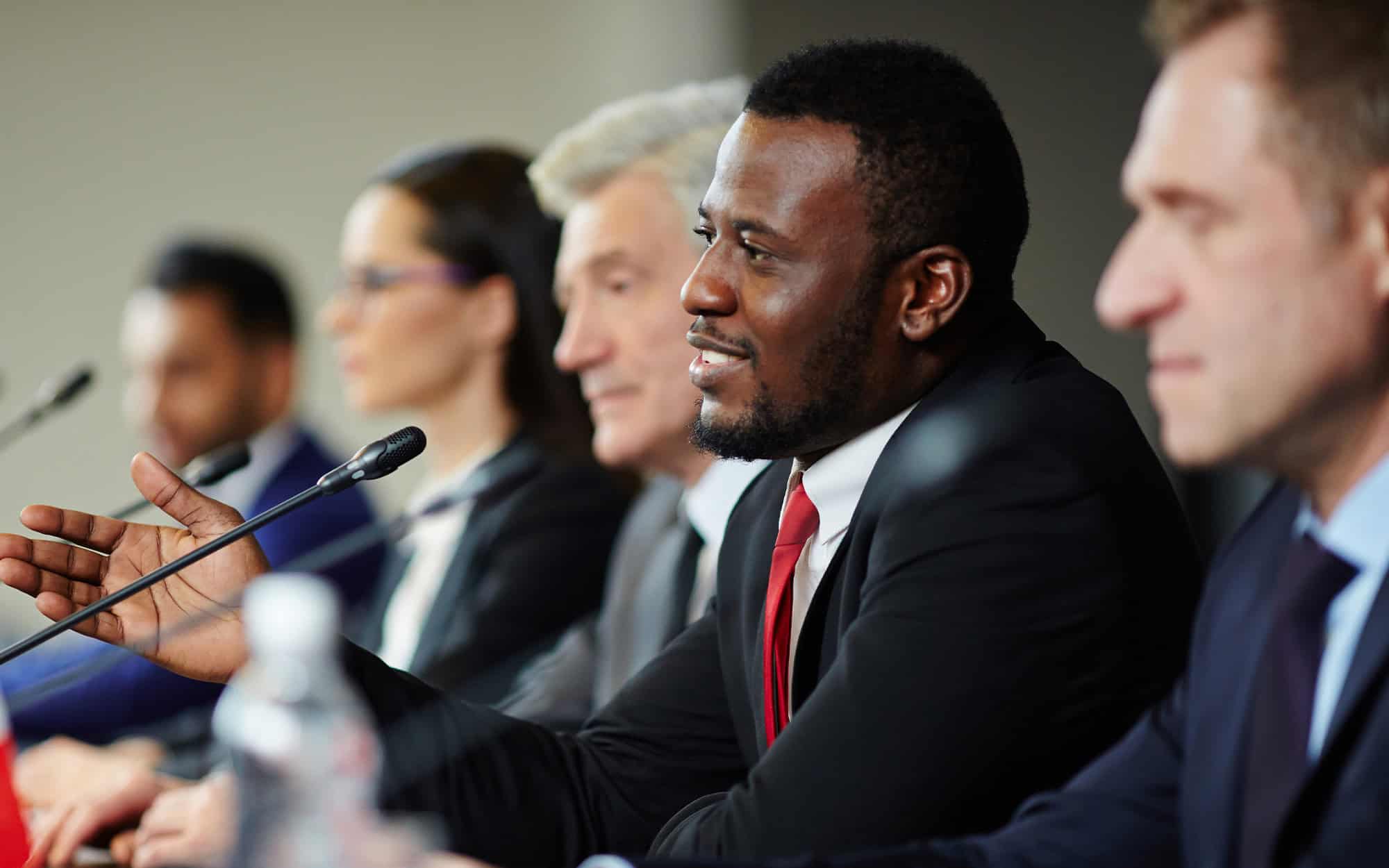 Side view of a politician public speaking at conference