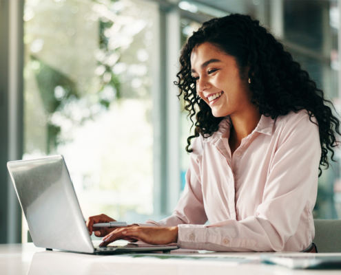 Finance, laptop and typing with business woman in office